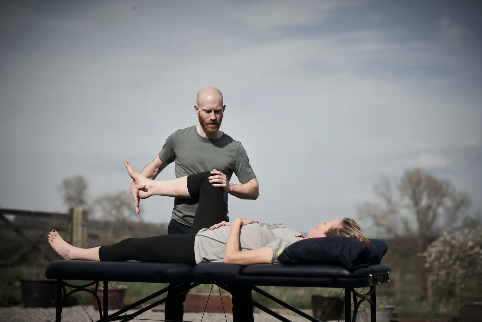 David Graham, osteopath in Leeds, assessing a patient’s hip and knee movement