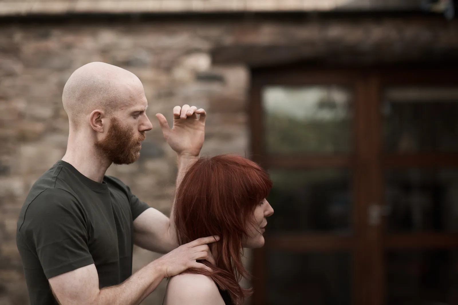 Osteopath David Graham treating a seated patient’s neck